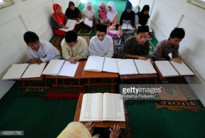 Visually impaired students read a Braille Quran at The Foundation for ...