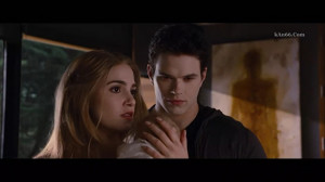 Emmett and Rosalie with Renesmee.