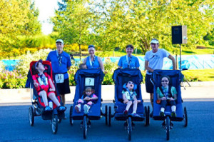 Parents who run races with their kids with disabilities