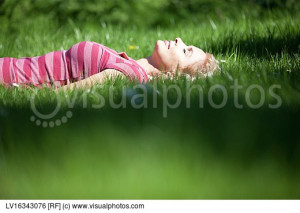 Smiling Baby Laying The Grass