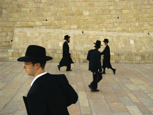 Orthodox Jews head toward the Western Wall, one of the most sacred ...
