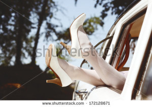 Slim pretty brides legs in white leather heels out of the vintage ...