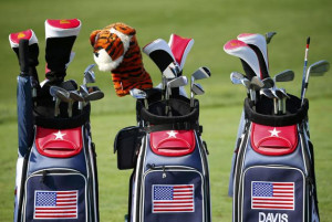 golfer Tiger Woods' golf bag is shown between those of fellow ...