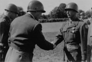 General Patton shakes the hand of Colonel James H. Polk, who receiveda ...