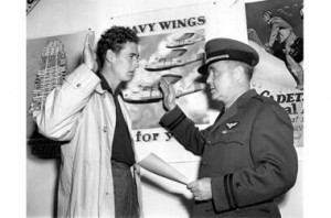 Ted Williams (l.) reenacts taking the oath to enlist in the U.S. Navy