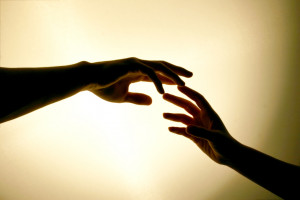 hands touching reaching out