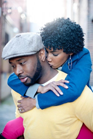 black-woman-kissing-man-on-neck