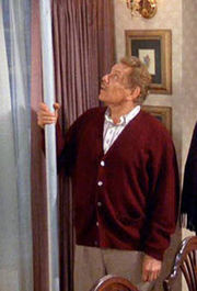 Frank Costanza holding the Festivus pole.