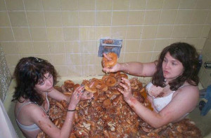 Drunk Girls with donuts in a bathtub