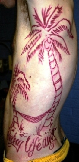 post navigation paintball gun tattoo rib palm tree tattoo