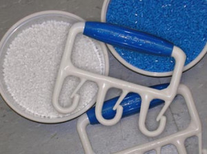 Plastic granules shown with finished molded product.