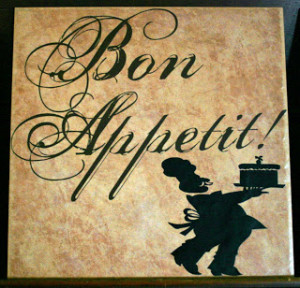 Bon Appetit in brown, chef with cake in black on tan 12