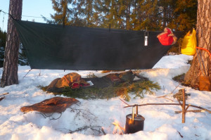 Winter Norwegian camp | Tarp, bedroll, spruce boughs and billy can.