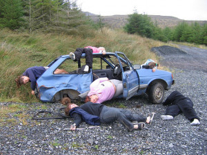 group of kids saw this wrecked car by the roadside and staged this ...