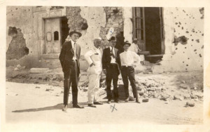 ... friends in front of bullet-ridden wall in Chihuahua after Revolution