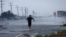 Highway 64 as wind pushes water over the road as Hurricane Arthur ...