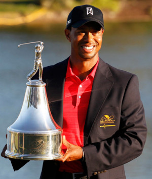Tiger Woods holds the trophy after winning the Arnold Palmer ...
