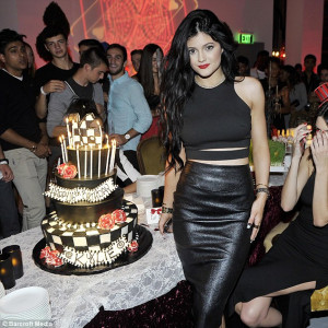 Gorgeous girl: Kylie was the belle of the ball in a leather skirt and ...