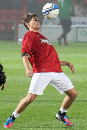 one direction louis tomlinson taking part in a charity football match