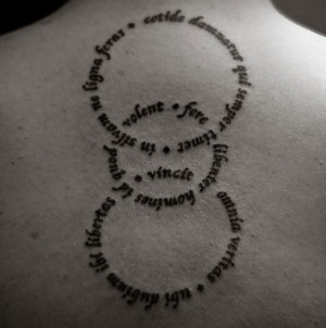 Artistic Circular Quote Tattoo on the back