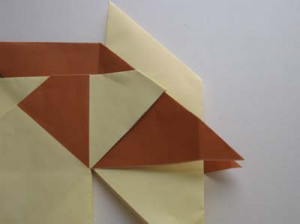 Modular Origami Pinwheel Step 13: The yellow unit is next. This is now