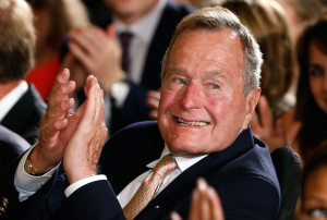 Image: Former President George H. W. Bush applauds during an event to ...