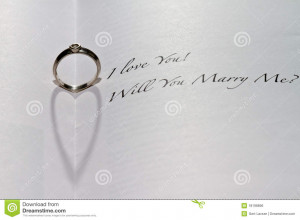 ... heart shadow in book with the sentence I Love You! Will You Marry Me