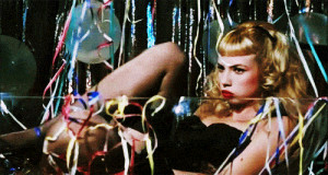 Traci Lords como Wanda Woodward en 