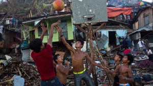 Kids in the Philippines play basketball among the ruins of Typhoon ...
