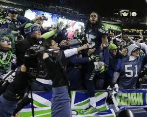 Seattle Seahawks' Richard Sherman celebrates with fans after after the ...