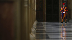 Swiss guard stands in a hall leading to the Pope's library at the ...