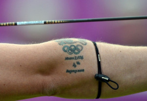 as he competes against Juan Rene Serrano of Mexico during the archery ...