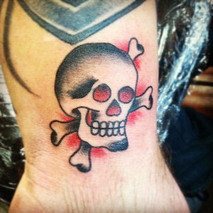 traditional-skull-crossbones-tattoo-rad-tough-manly-tattoo.jpg