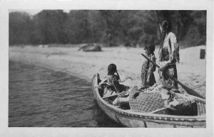 Ojibwa Indian women on a canoe.