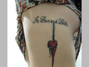 below this quote tattoo about love and death on the side of the body