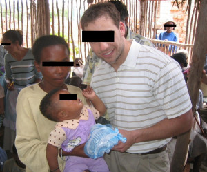 211 Taking pictures with poor foreign children on missions trips