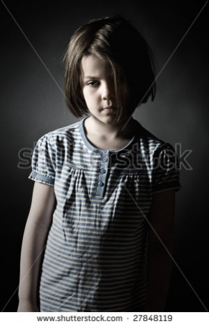 Key Shot of a Sad Little Girl against Grey Background - stock photo ...