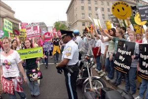 Police barricade pro-choice from pro-life activists at March for Women ...