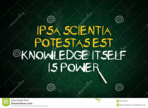Knowledge is power. Latin quote handwritten with chalk on a green ...