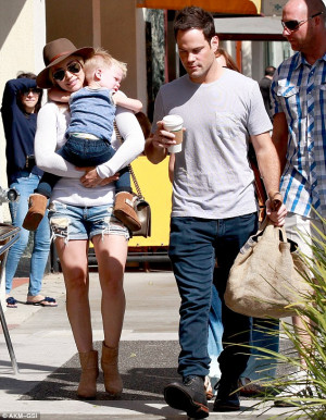 Together apart: Mike and Hilary - seen here last month with their son ...