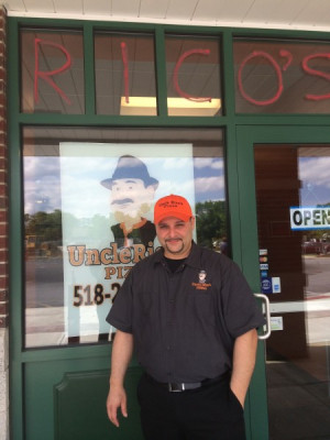 Errico Magnoli stands outside the new Uncle Rico's Pizza at Shop-Rite
