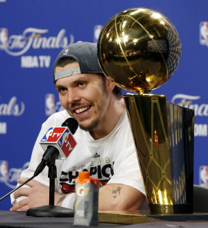 sits with the Larry O'Brien trophy after his team won the championship ...