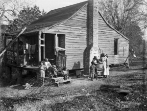 Women wash clothes in the yard of a FORMER SLAVE SHACK on a Natchez ...