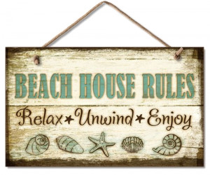... it is feel like a beach house this beach house rules wood sign lays