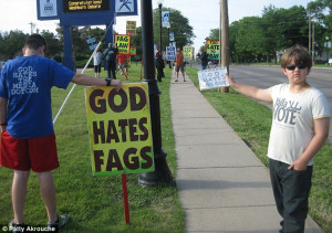 ... Church anti-gay slogans, pictured, encouraged him to paint the house