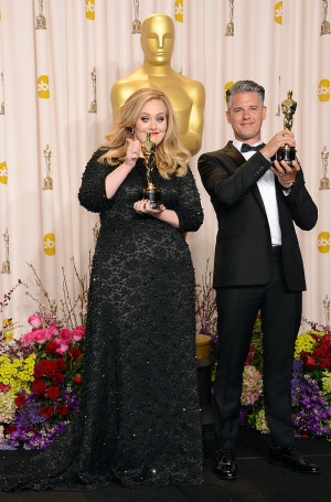 adele and paul epworth posed together with their oscars