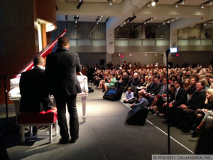 wedge teleprompter at Sotheby's with Bono and Chris Martin