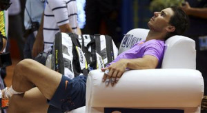Rafael Nadal of Spain rests after beating David Nalbandian of ...