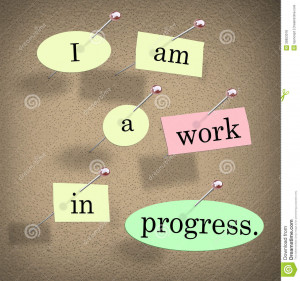 Am a Work in Progress quote or saying on pieces of paper pinned to a ...