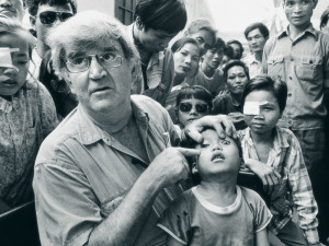 Fred Hollows examines Tran Van Giap, Vietnam. Photo: Michael Amendolia